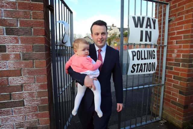 SDLP leader Colum Eastwood and daughter Rosa outside a polling station at Model Primary School in Londonderry
