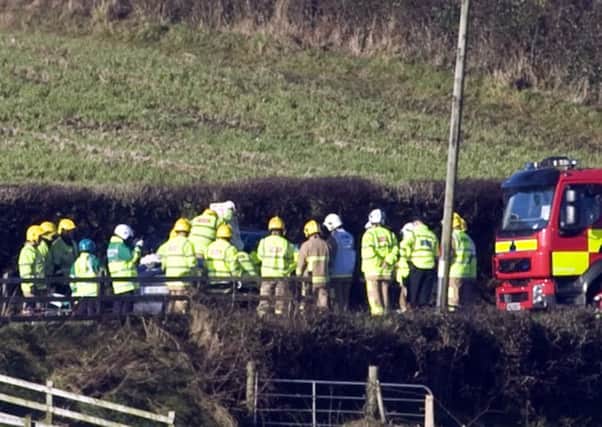 Emergency services at the scene following the fatal crash on the Melmount Road outside Sion Mills in January 2014