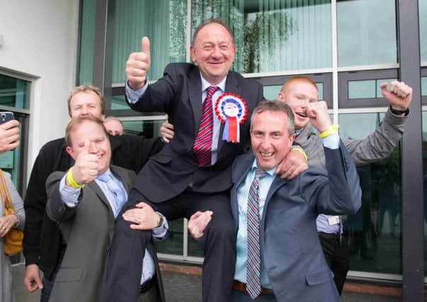 William Irwin topped the poll in Newry and Armagh, with a first count total of 7989. Also pictured are councillor Gareth Wilson, left, and Mr Irwin's campaign manager, Lavelle McIlwrath, right