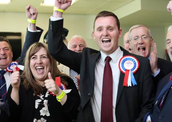 Successful DUP candidate Gary Middleton celebrates his election with party colleagues and supporters