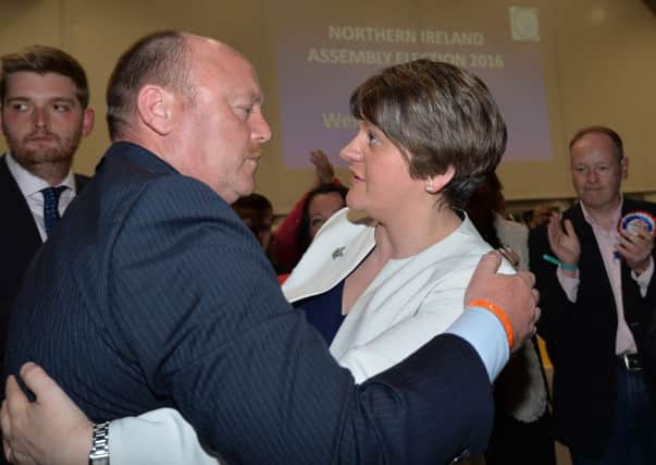 Arlene Foster consoles Frank McCoubrey after he narrowly missed out on a seat in West Belfast