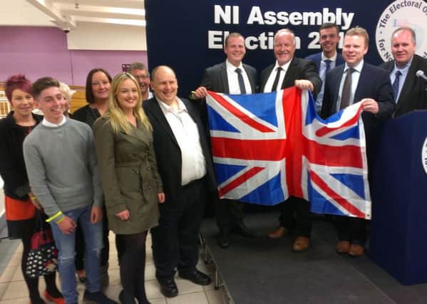 Successful DUP candidates David Hilditch, Alastair Ross and Gordon Lyons with their campaign team and party supporters