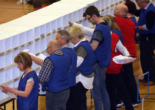 Votes are sorted at the Valley Leisure Centre election count