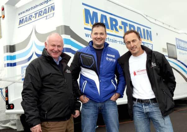 Jeremy McWilliams with Mar-Train Yamaha's Tim Martin and North West 200 Event Director, Mervyn Whyte.