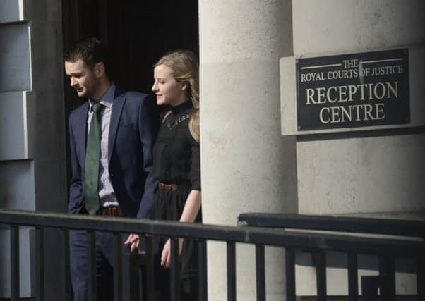 Daniel McArthur and his Wife Amy at Belfast High Court on Monday. Colm Lenaghan/Pacemaker