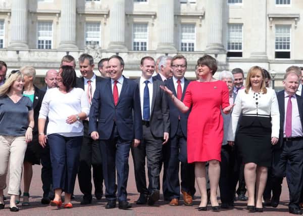 DUP leader Arlene Foster and deputy leader Nigel Dodds with their new team of MLAs at Stormont on Monday