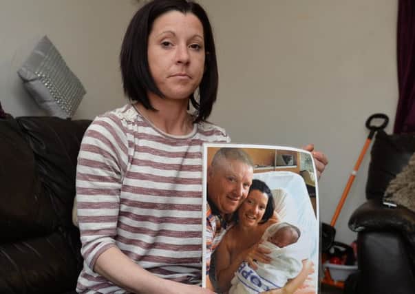 Ciara Austin,  partner of murdered Dan Murray holds a picture (of her Partner Dan, at the birth their Son Podraig (who is is now 2).