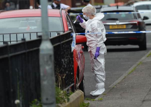 Police Forensics  at the scene of a shooting in West Belfast on Monday evening where Dan Murray, a takeaway delivery driver, had been taking an order to Lady Street, near Grosvenor Road, when he was shot.