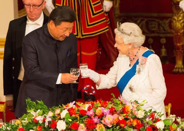 Chinese President Xi Jinping with Queen Elizabeth II at a state banquet at Buckingham Palace, London, during his state visit to the UK