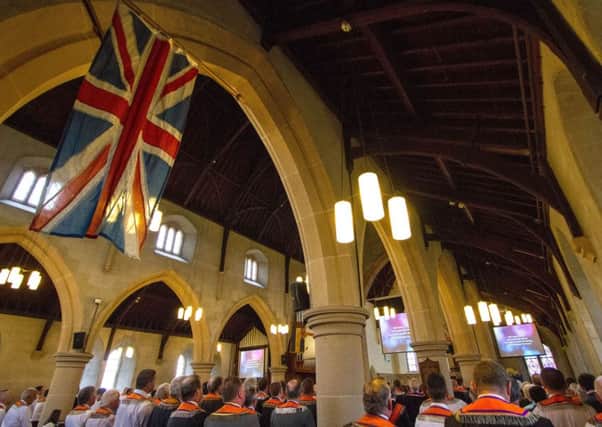 Orangemen during worship at the annual Drumcree Church service.

Lodge Life