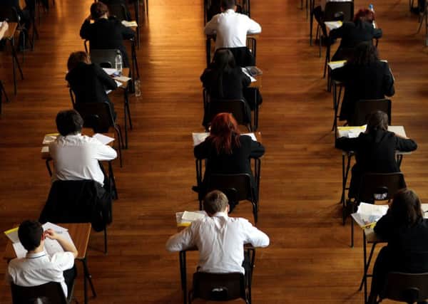 File photo dated 02/03/12 of a maths exam in progress, as rising numbers of young people are seeking help for worries about exam stress, according to ChildLine