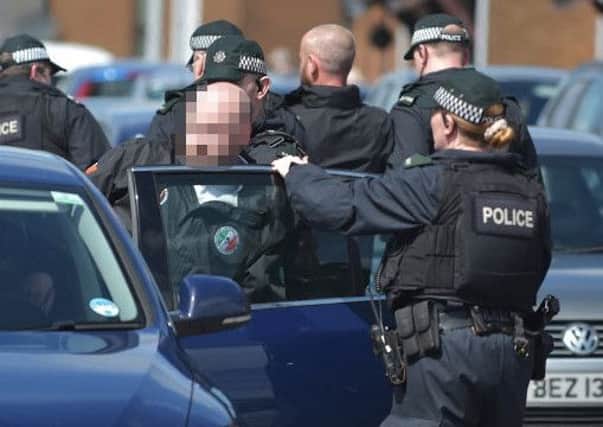 A man is arrested at last week's funeral of Michael Barr in Strabane