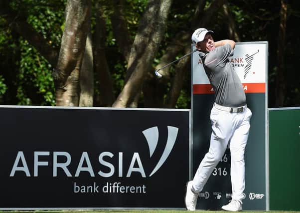 Andrew Dodt plays a shot during the first round of AfrAsia Bank Mauritius Open at Four Seasons Golf Club Mauritius at Anahita