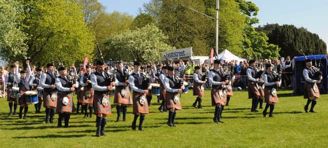 Pipe Major Nigel Davidson and Bleary and District Pipe Band pictured entering the competition arena at the Ards and North Down Pipe Band Championships at Castle Grounds, Bangor on Saturday 14th May.