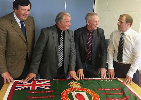 (Left to right) Loyalist Communities Council (LCC) member David Campbell, East Belfast community worker and former loyalist prisoner Jim Wilson, UDA leader Jackie McDonald, and Progressive Unionist Party representative Winston Irvine with new LCC Somme flag at the Farset Centre in Belfast, as the LCC has issued a new protocol on flags and bonfires with the stated intent of reducing tensions and ensuring respect around the often contentious issues