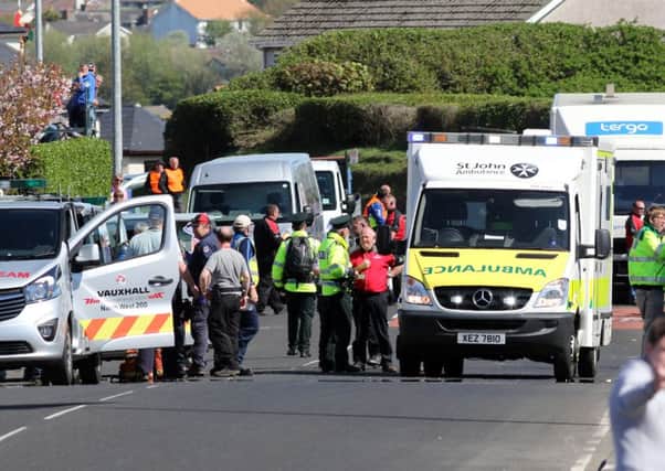 North West 200 Event Director Mervyn Whyte (red shirt) at the scene of the fatal crash on Saturday.