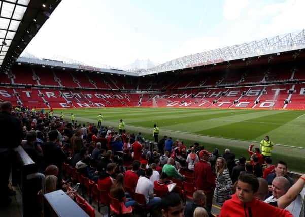 Empty stands after a security alert during the Barclays Premier League match at Old Trafford. Photo: Martin Rickett/PA Wire.