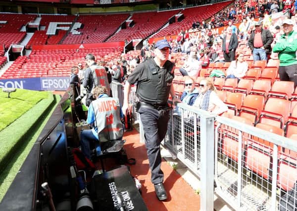 A sniffer dog during the Barclays Premier League match at Old Trafford, Manchester