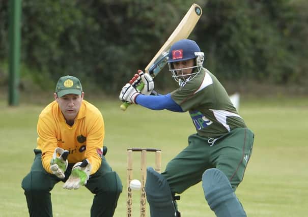 Downpatrick's Amit Patil in action against North Down