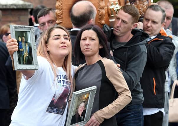 Ciara Austin (right) the partner of Dan Murray during his funeral at Holy Trinity Church in west Belfast
