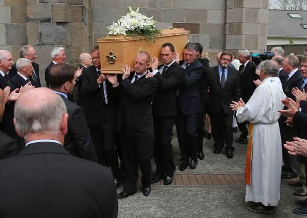 The coffin of Christy O'Connor Snr is carried into St John the Baptist Church on Clontarf Road in Dublin, where his funeral is taking place