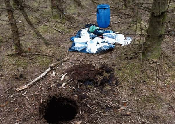 The barrel containing the weapons was recovered from a purpose-built hole at a "terrorist hide" in woodland at Capanagh Forest near Larne