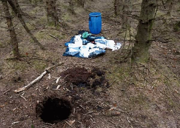 The barrel containing weapons was recovered from a purpose-built terrorist hide in woodland at Capanagh Forest near Larne