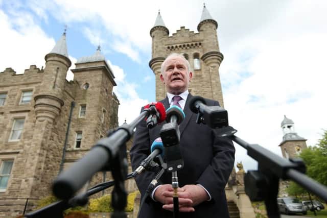 Deputy First Minister Martin McGuinness speaking to the media after meeting with Foreign Affairs Minister Charlie Flanagan (not pictured) at Stormont Castle in Belfast
