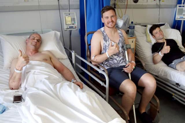 Thumbs up from Ryan Farquhar (left), Nico Mawhinney and Paul Gartland, as they recover in the RVH after their crashes at last weeks North West 200. 
Picture: Stephen Davison