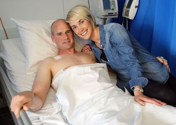 Ryan Farquhar with wife Karen in the Royal Victoria Hospital as he recovers from his crash injuries. Picture: Stephen Davison