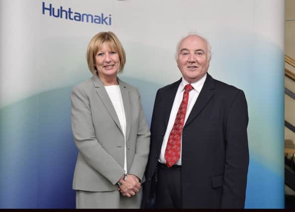 Delta Print and Packaging founder Terry Cross shakes on the deal with Rosemary Mason MD, Huhtamaki Foodservice Western Europe and UK