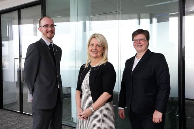 Pinsent Masons partner Andrea McIlroy-Rose, centre, with Gavin Boyd, Rainbow Project, and Catherine Vaughan of EY