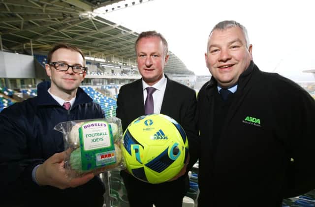Northern Ireland Manager Michael ONeill, centre, with Chris Moore of Irwins Bakery and Billy Clelland, Asda