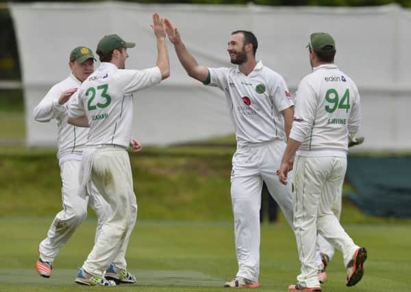 North Down's Daniel Graham celebrates after catching James McCollum off Peter Malan
