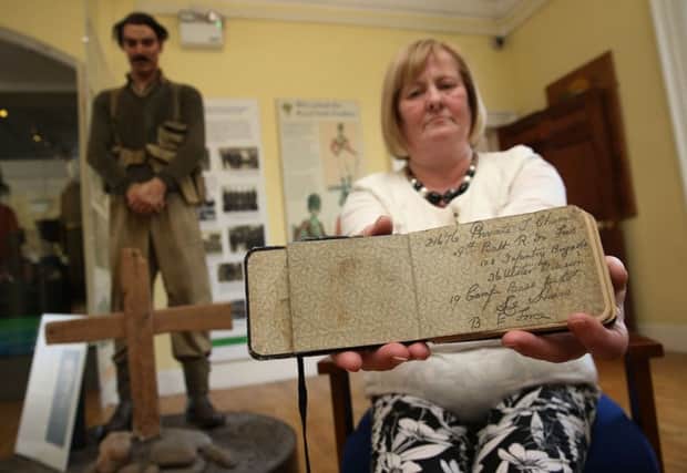 Helen McComb holds the diary of her great uncle Private Thomas Chambers