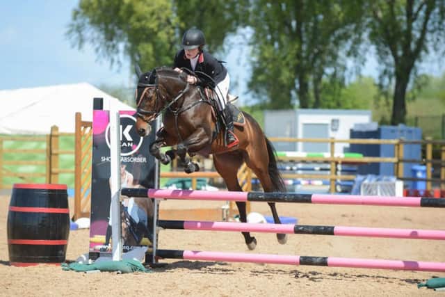 Annie Courtney Cadam riding LCC Kitty, clear in the 90cm