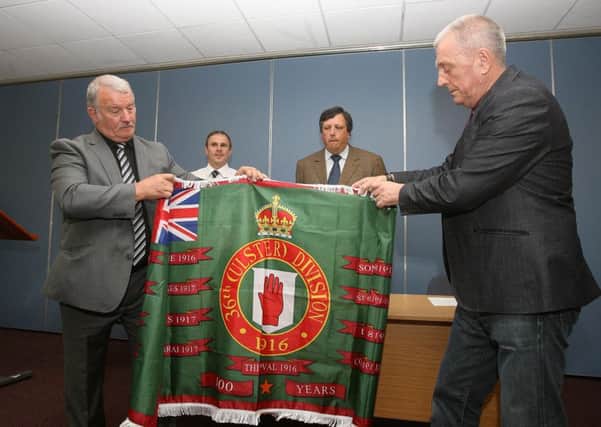 A flag is unveiled by the Loyalist Communities Council (LCC) for the centenary of the Battle of the Somme. From left Jim Wilson, Winston Irvine, David Campbell, Jackie McDonald. 
Picture By: Pacemaker Press.