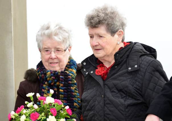 May Quinn (left, pictured with Beatrice Worton whose son died at Kingsmills) said her brother Bobby Walker was 'always helping and working for other people'