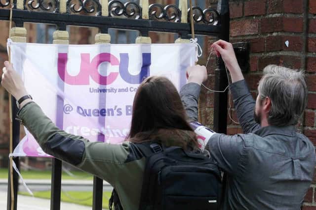 Some staff at Queen's and Ulster University to go on two-day strike over pay.  Members of the University and College Union (UCU)  are taking part in the action in response to a 1.1% pay rise.  Strikers in front of Queen's University.