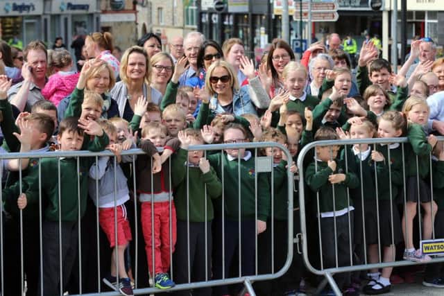 School children await the arrival of the Prince of Wales and the Duchess of Cornwall in Donegal Town, as Charles is visiting the Republic of Ireland in the latest royal bid to solidify transformed Anglo-Irish relations