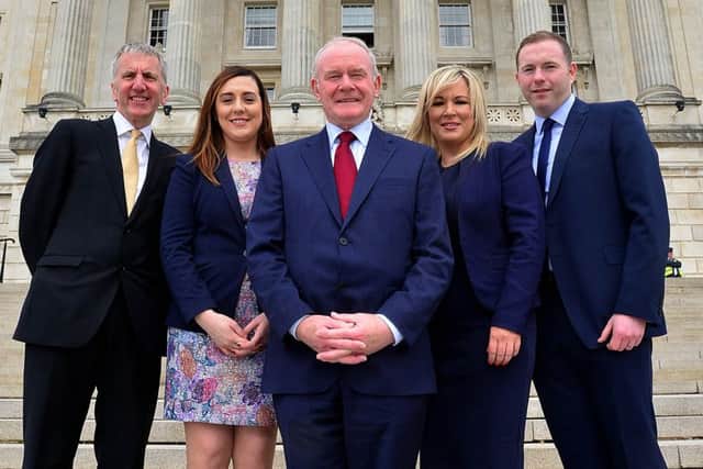Martin McGuinness (centre) with Sinn Fein's new ministerial team: MÃ¡irtÃ­n Ã“ Muilleoir, Megan Fearon, Michelle ONeill and Chris Hazzard