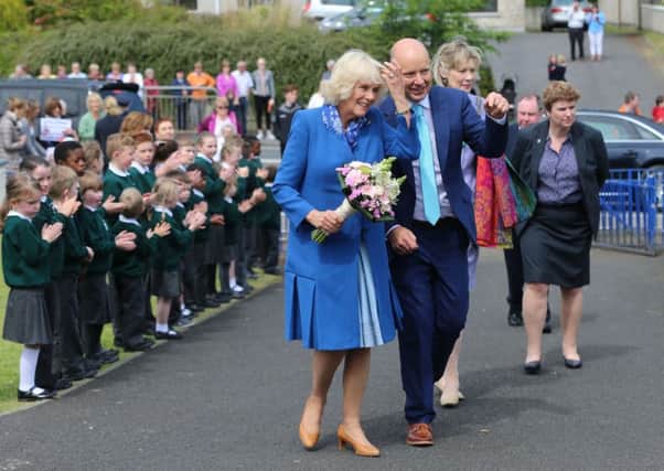 The Duchess of Cornwall meets students during a visit to the Ballyraine National School in Letterkenny, Co Donega