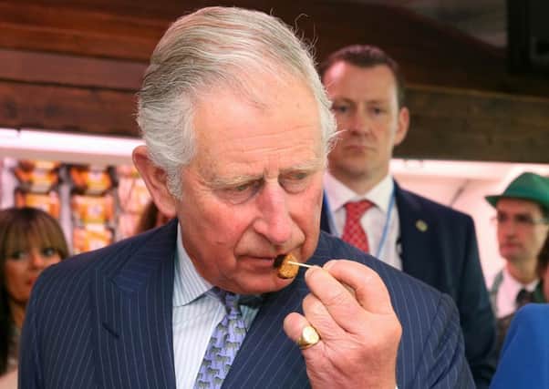 The Prince of Wales samples award-winning sausages at McGettigan's butcher's shop in Donegal Town, as Charles visits the Republic of Ireland in the latest royal bid to solidify transformed Anglo-Irish relations
