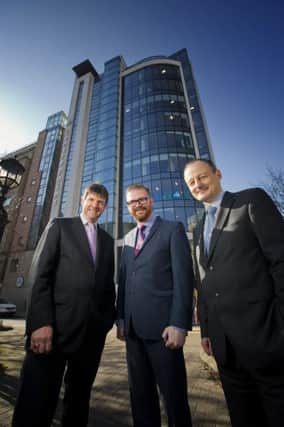 Mr Hamilton, seen here with Jeremy Harbinson and Paul Mulholland of accountancy practice Harbinson Mulholland, has already established solid links with the business community during his time as Finance Minister