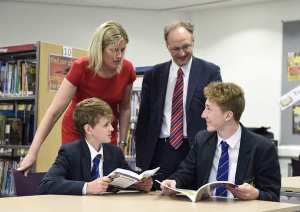 New Education Minister, Peter Weir pictured with Elizabeth Huddleson, principal of Bangor Grammar School and pupils Ewan McKenzie (left) and Conor Lusty (right) during a visit to the school. Picture: Michael Cooper