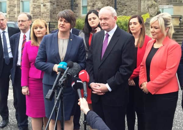 First Minister Arlene Foster and Deputy First Minister Martin McGuinness and the new-look Stormont Executive outside Stormont Castle this week