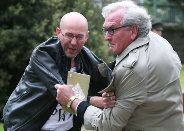 Canadian Ambassador to Ireland Kevin Vickers wrestles with a protester (left) during a State ceremony to remember the British soldiers who died during the Easter Rising at Grangegorman Military Cemetery, Dublin.   Photo: Brian Lawless/PA Wire