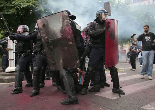 French police confront protestors demonstrating against labour reform