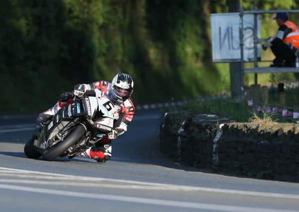 Michael Dunlop on the Hawk Racing BMW Superbike during practice for the Isle of Man TT.