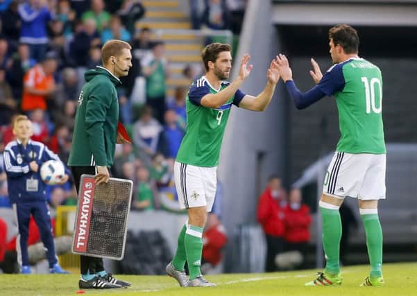 Will Grigg comes on to replace Kyle Lafferty on Friday night